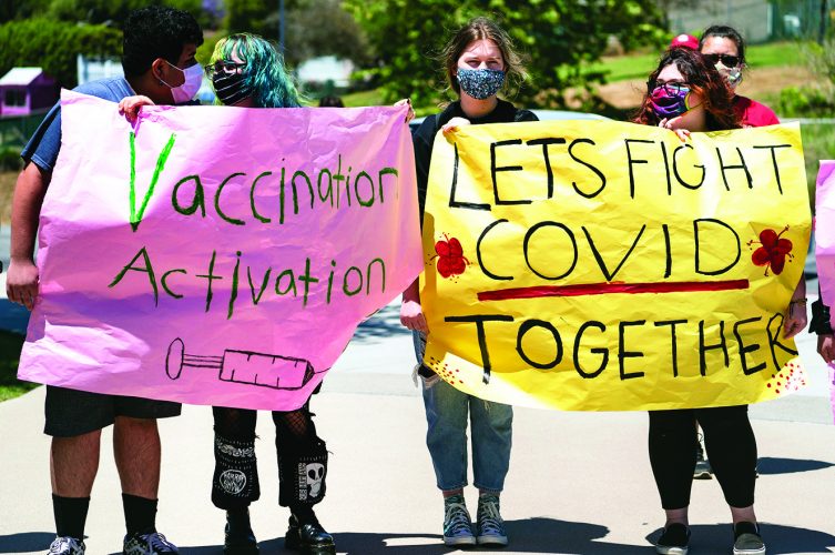 Schools try pep-rally tactics to get students vaccinated